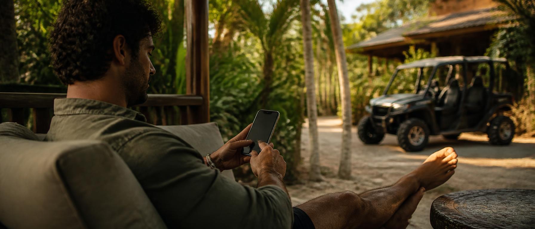 Traveler booking from a smartphone at a tropical villa